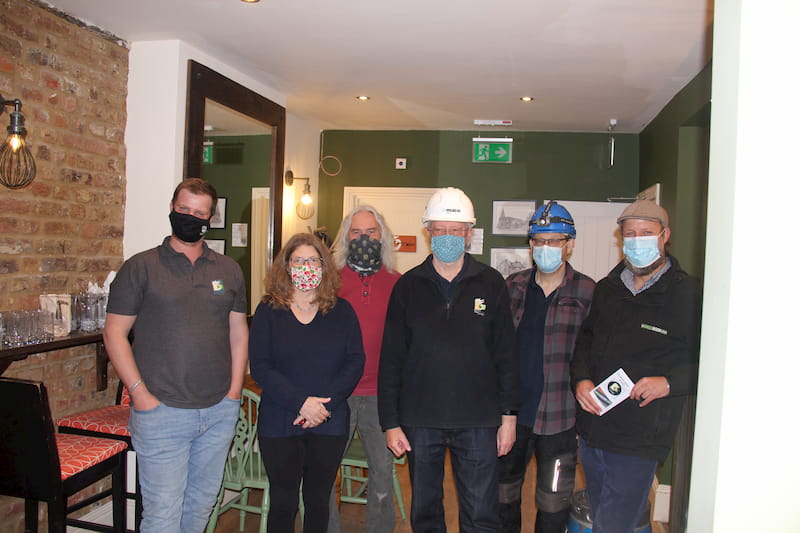 More of the team indoors and masked-up