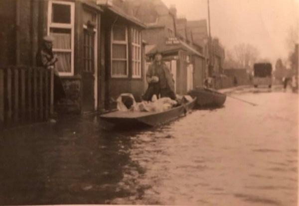 Man in a boat outside the pub